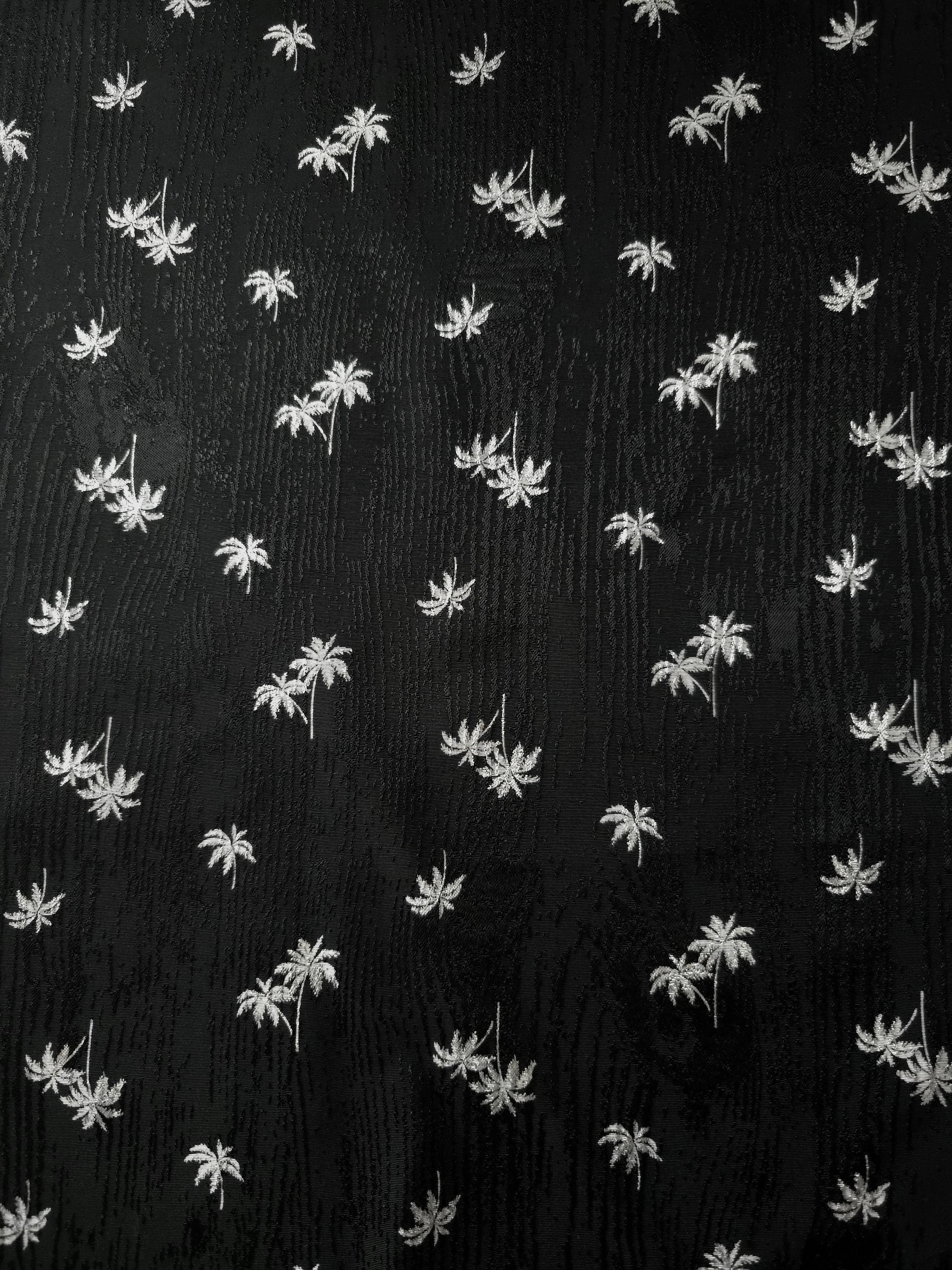 Complete jet black mini palm tree layout on jacquard fabric for shirts, midi dresses and tailored skirts.