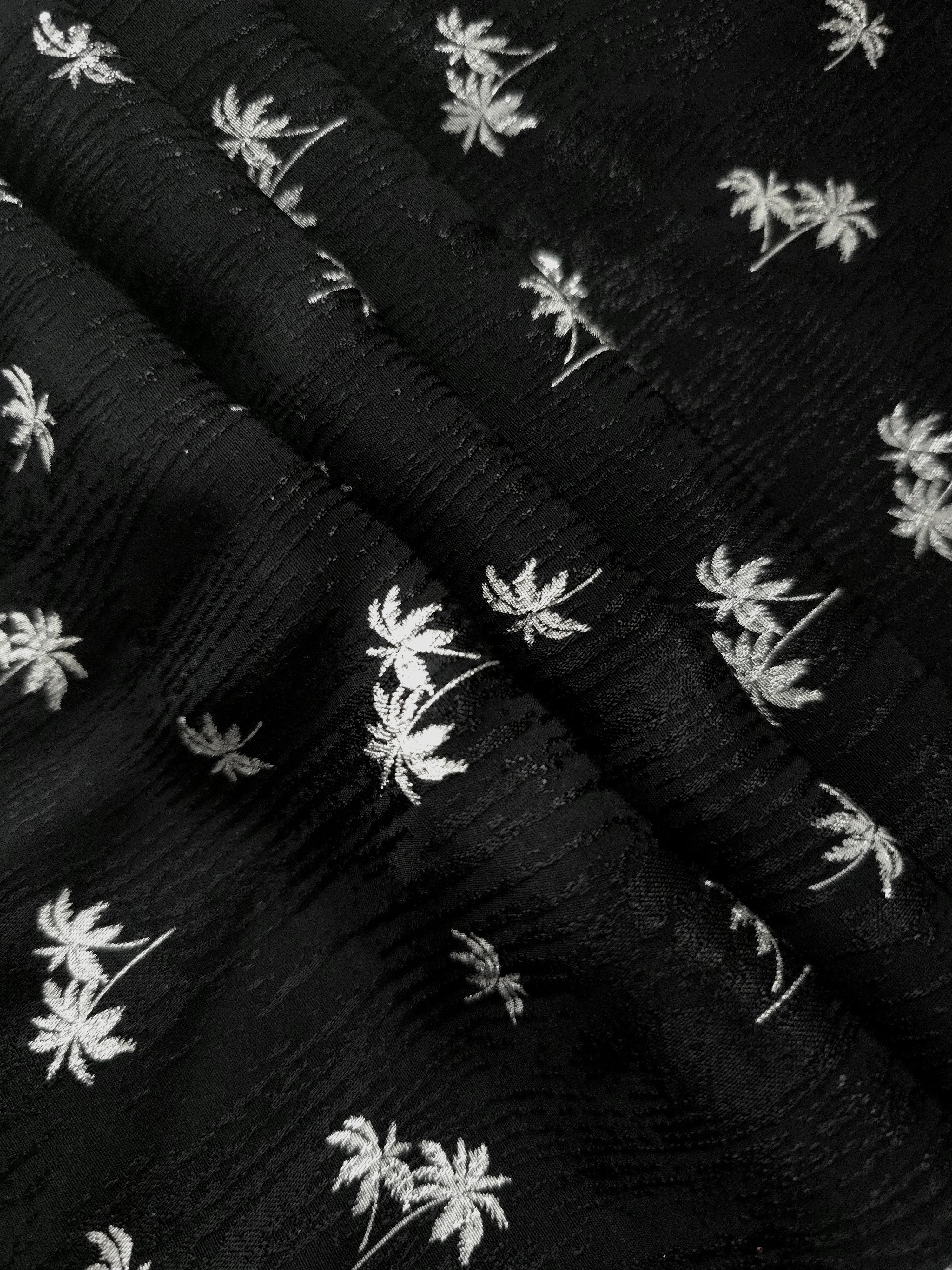 Layered jet black printed jacquard revealing soft volume for two-piece sets, kimono jackets and overshirts.