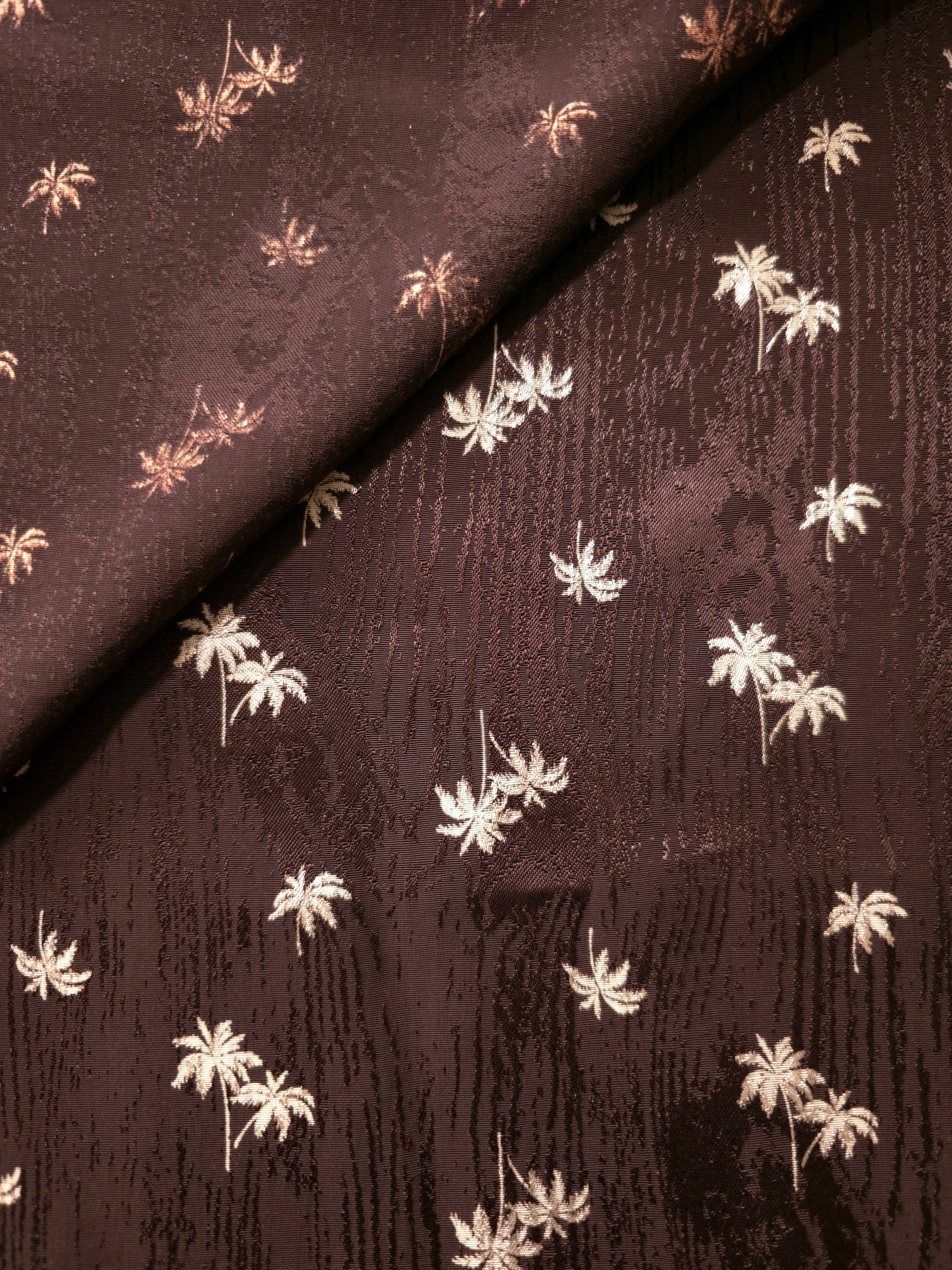 Front and back surfaces of mocha brown printed jacquard for abayas, tunics and garments with visible facings.