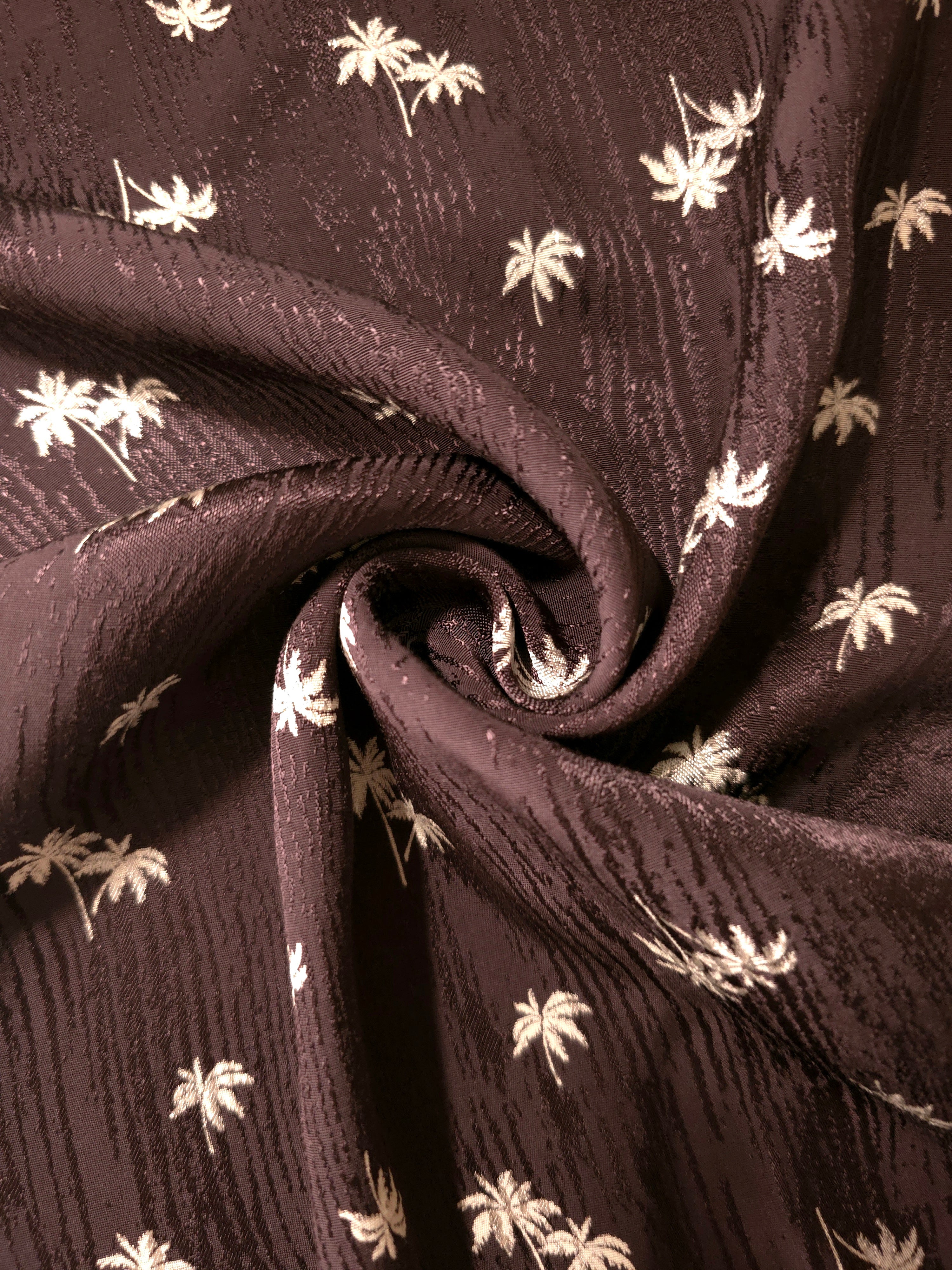 Loosely gathered mocha brown jacquard displaying movement for tiered skirts, maxi dresses and palazzo trousers.