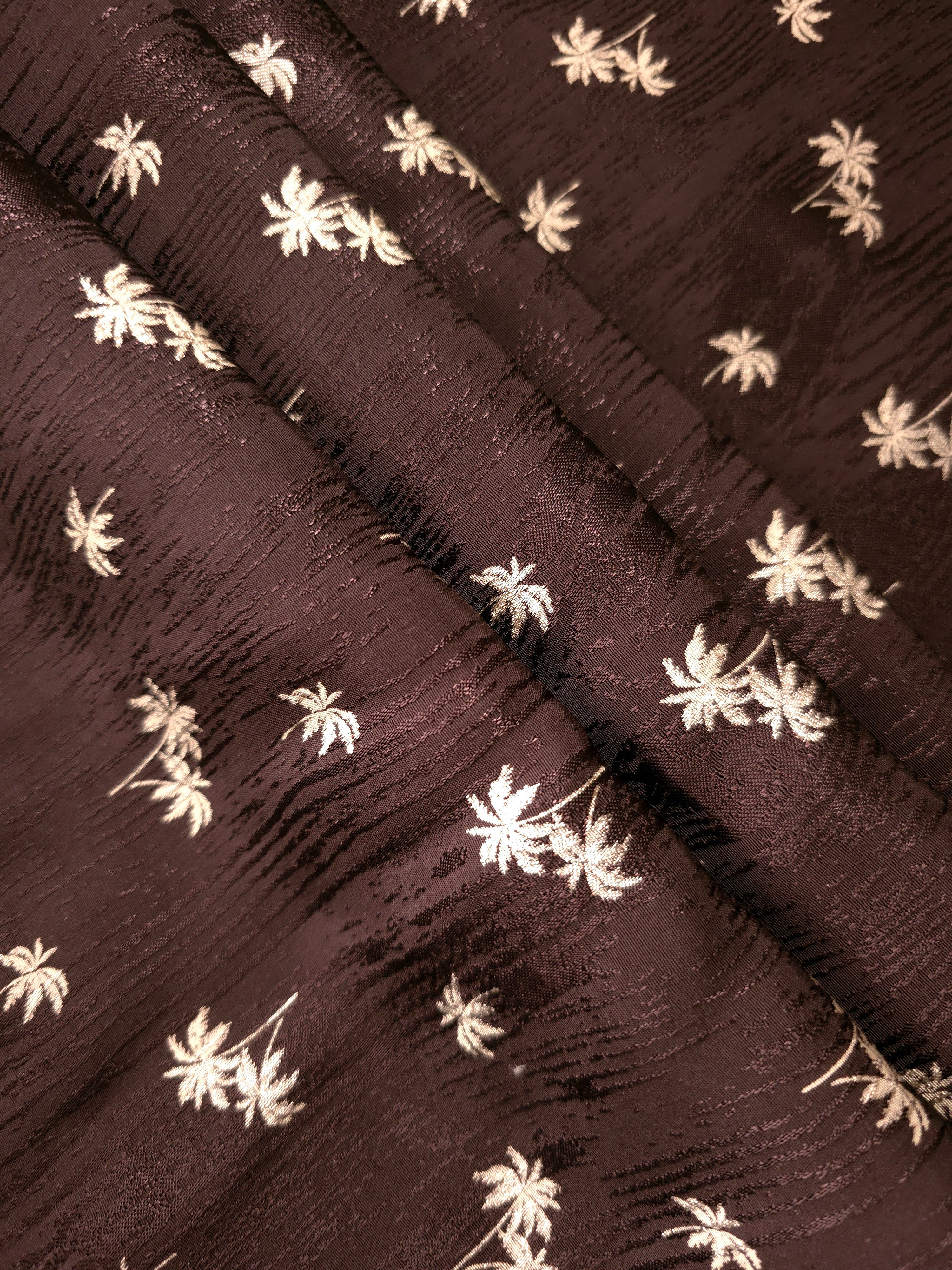 Rich mocha brown jacquard in layered folds, suited to coordinated outfits, soft jackets and long vests.
