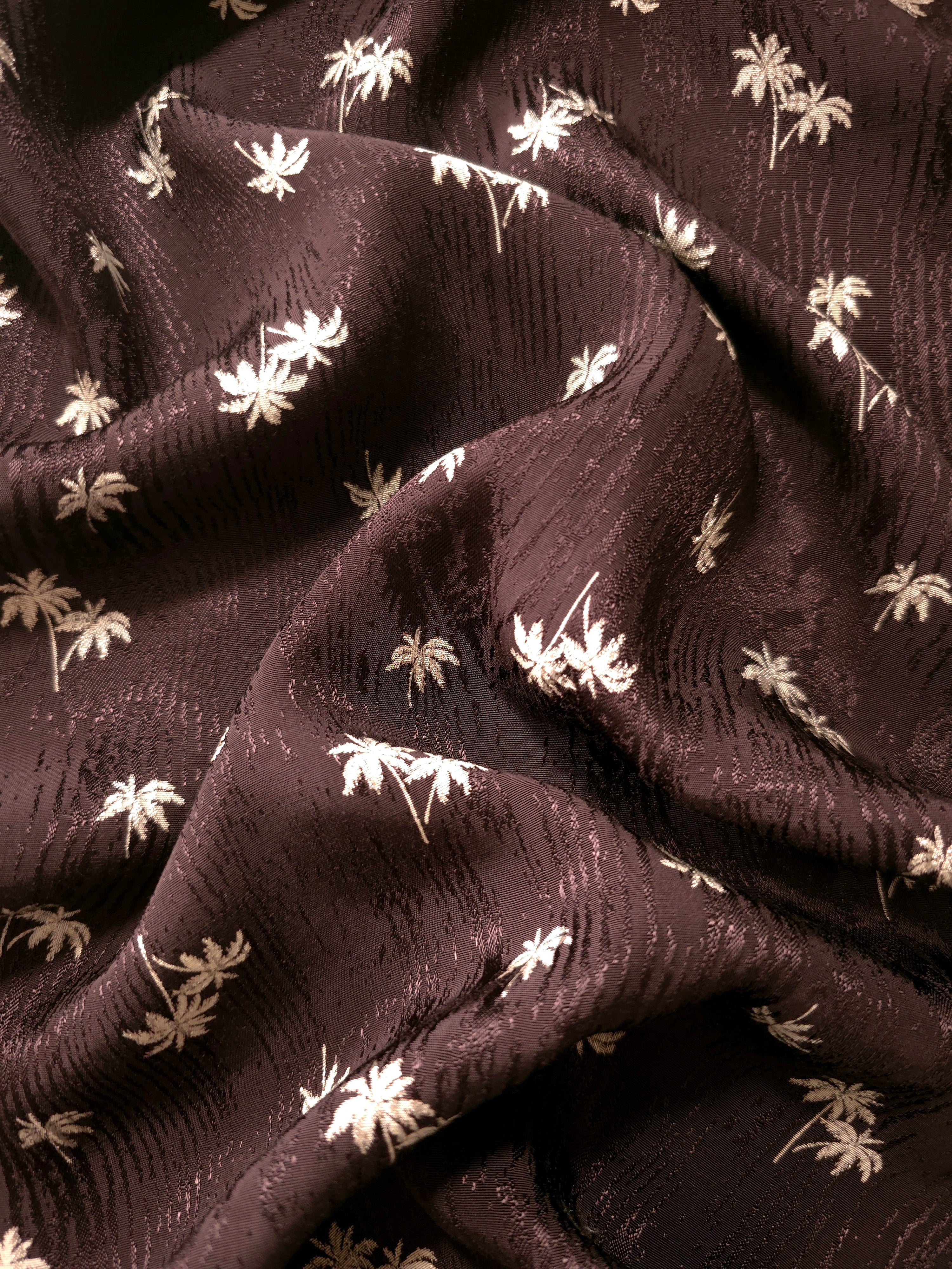 Mocha brown palm tree jacquard cascading in soft folds for autumn dresses, kaftans and relaxed outer layers.