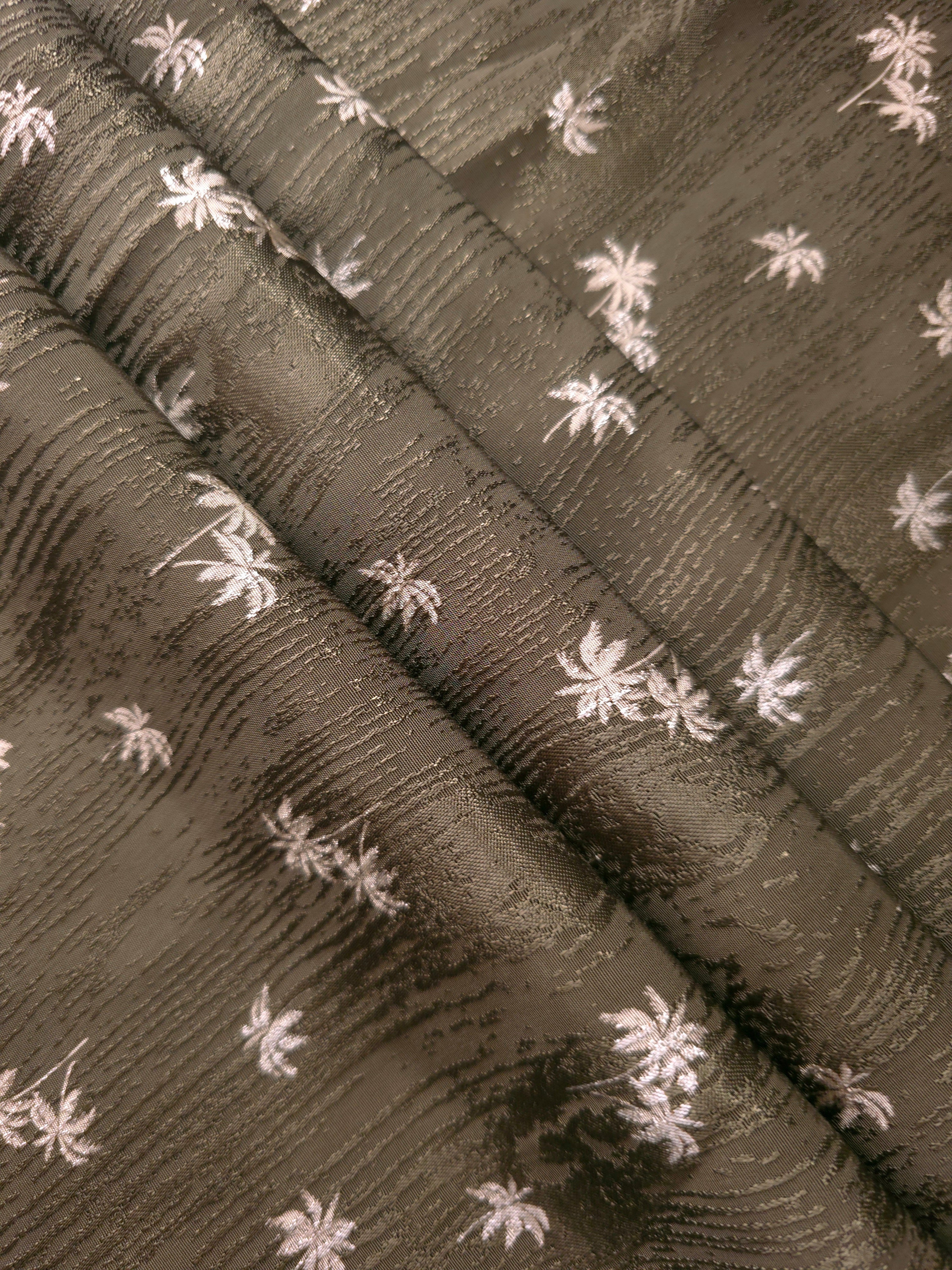 Layered olive green rayon viscose jacquard folds displaying sheen and body for coordinated sets and overshirts.