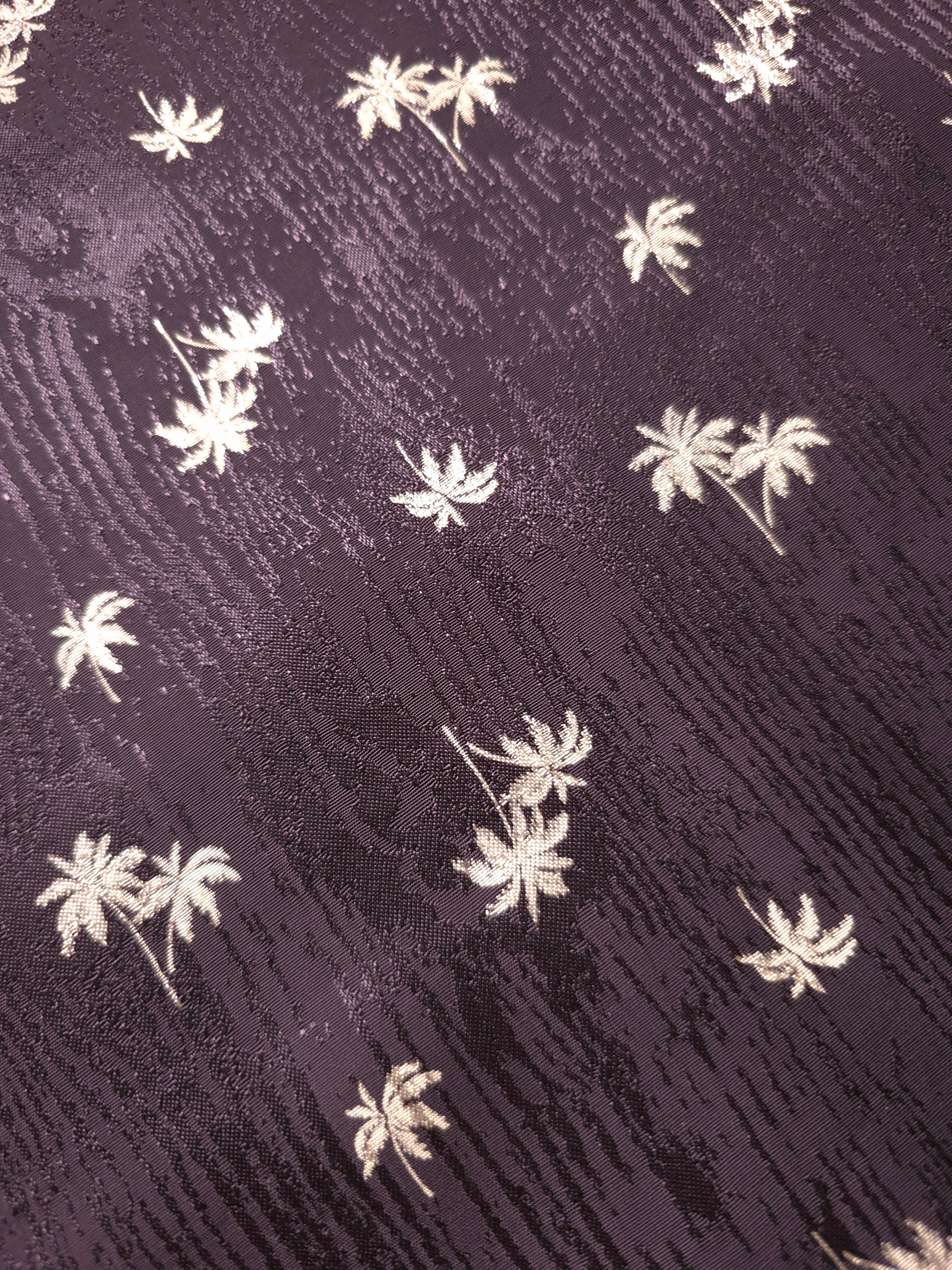 Detailed plum purple jacquard weave with mini palm motifs, useful for collars, cuffs and elegant shirtmaking.