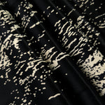 Folded Formal Black - Charcoal distressed ink line rayon, 176 GSM fabric for boutique modestwear sourcing.
