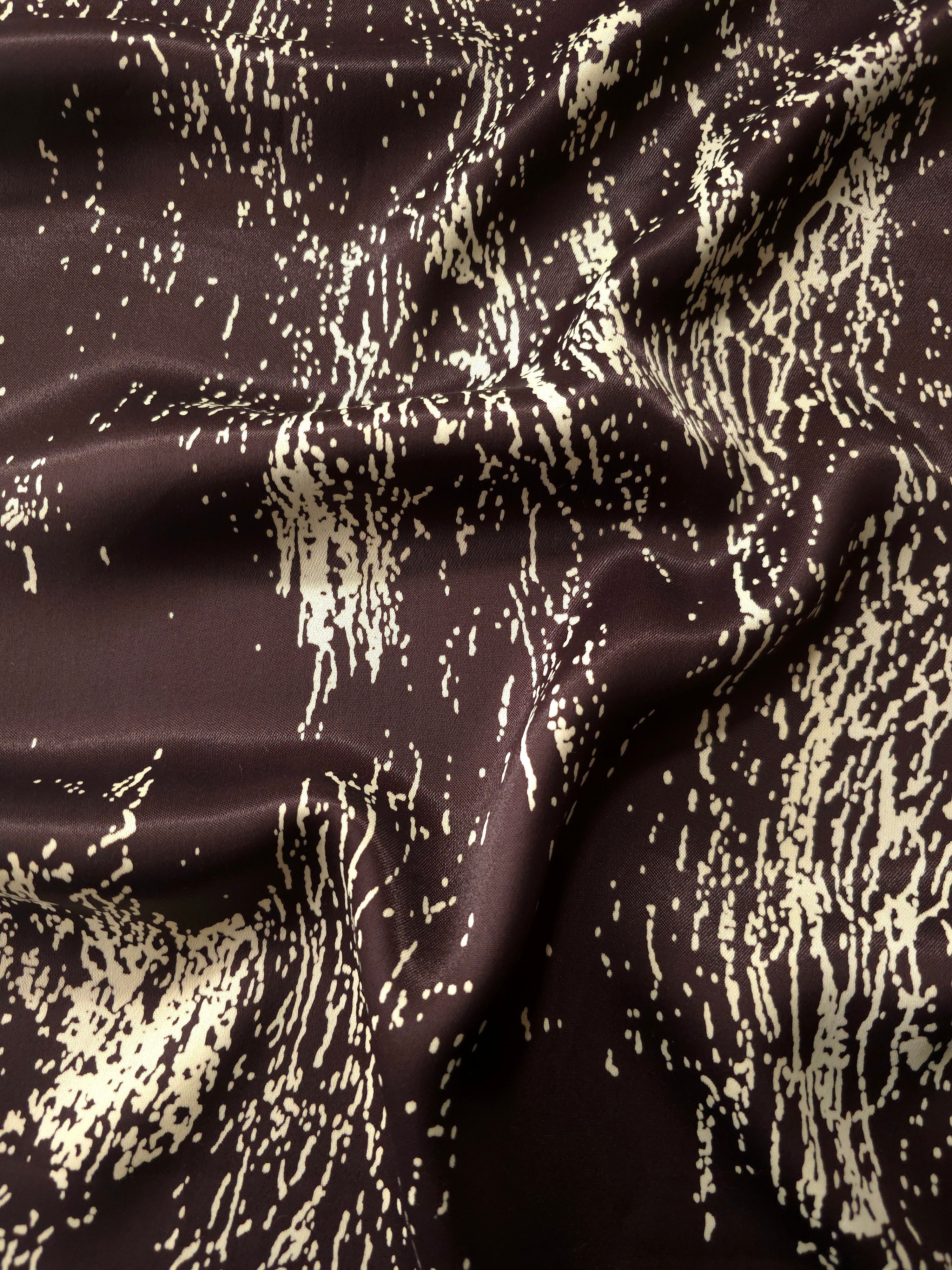 Wave shot of Chocolate Brown - Black silky rayon with distressed line print for Eid kaftans and abayas.