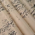 Folded Vanilla Cream - Black distressed ink line rayon fabric, 176 GSM Turkish textile for boutique sourcing.