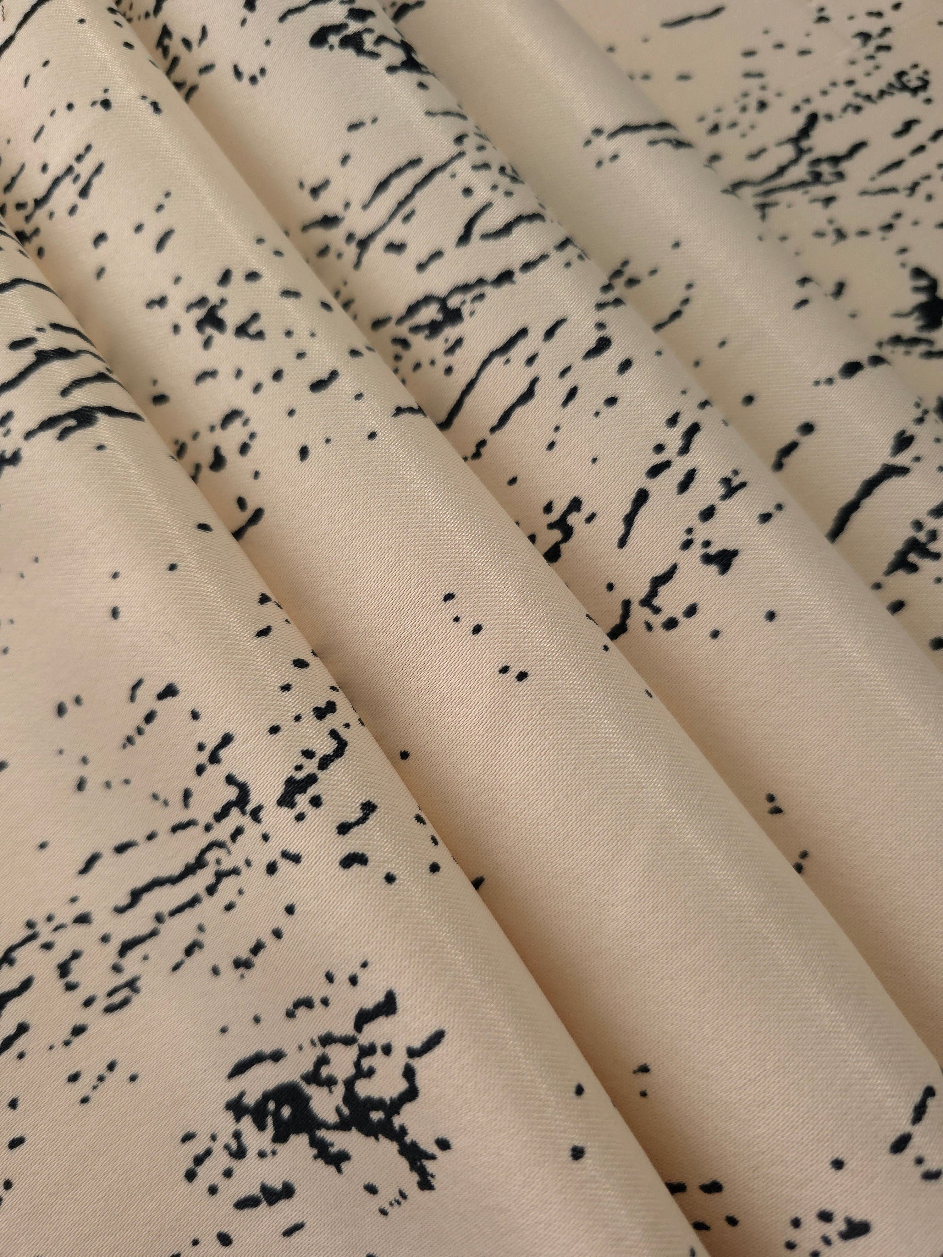 Folded Vanilla Cream - Black distressed ink line rayon fabric, 176 GSM Turkish textile for boutique sourcing.