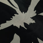 Close-up of Formal Black - Charcoal silky rayon fabric with tonal bold abstract petal print for modestwear.