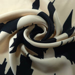 Drape shot of Vanilla Cream - Black silky rayon fabric for soft abaya silhouettes and kaftan dressmaking.