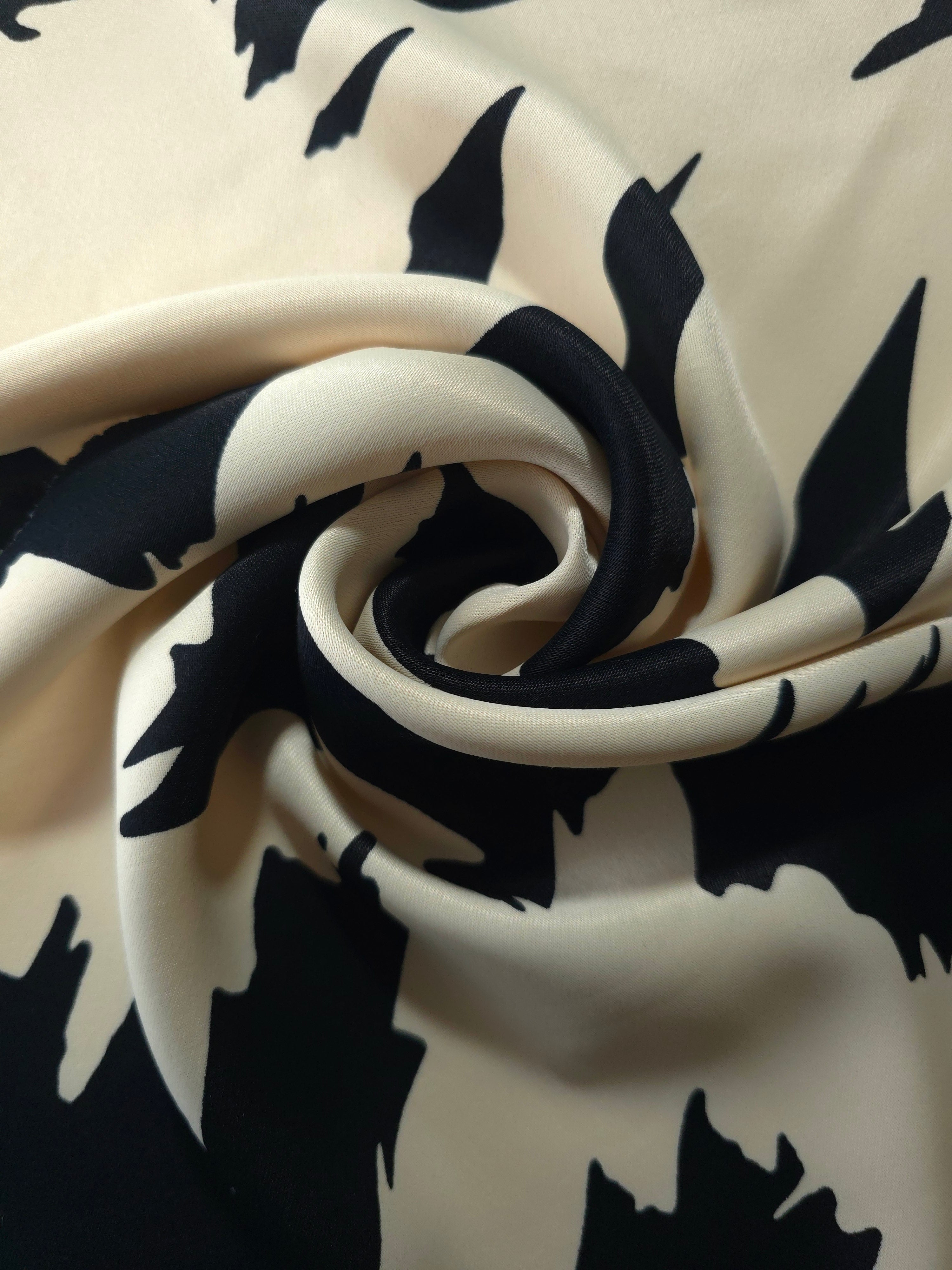 Drape shot of Vanilla Cream - Black silky rayon fabric for soft abaya silhouettes and kaftan dressmaking.