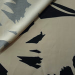 Front and back view of Vanilla Cream - Black bold abstract petal fabric for opacity and lining checks.