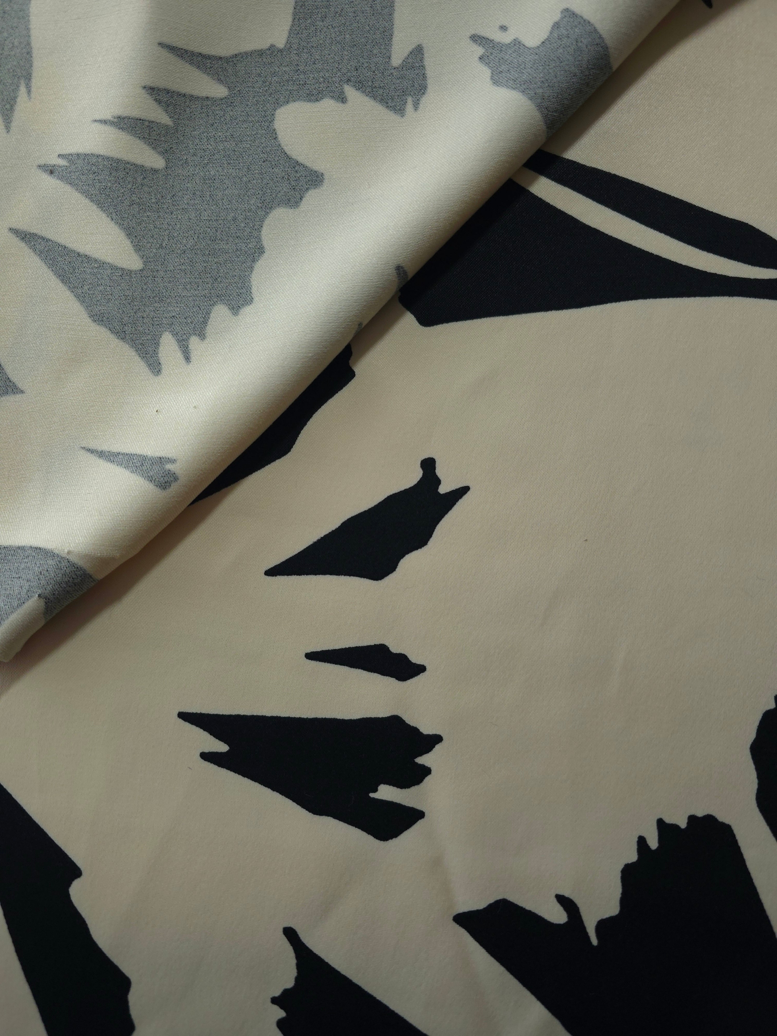 Front and back view of Vanilla Cream - Black bold abstract petal fabric for opacity and lining checks.