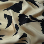 Wave shot of Vanilla Cream - Black silky rayon fabric with bold petal print for Eid modest dress designs.
