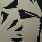 Wide shot of Vanilla Cream - Black Turkish silky rayon fabric for abaya, kaftan and boutique yardage planning.
