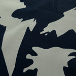 Close-up of Midnight Blue - Black Turkish silky rayon fabric with bold abstract petal print for abaya and kaftan designs.