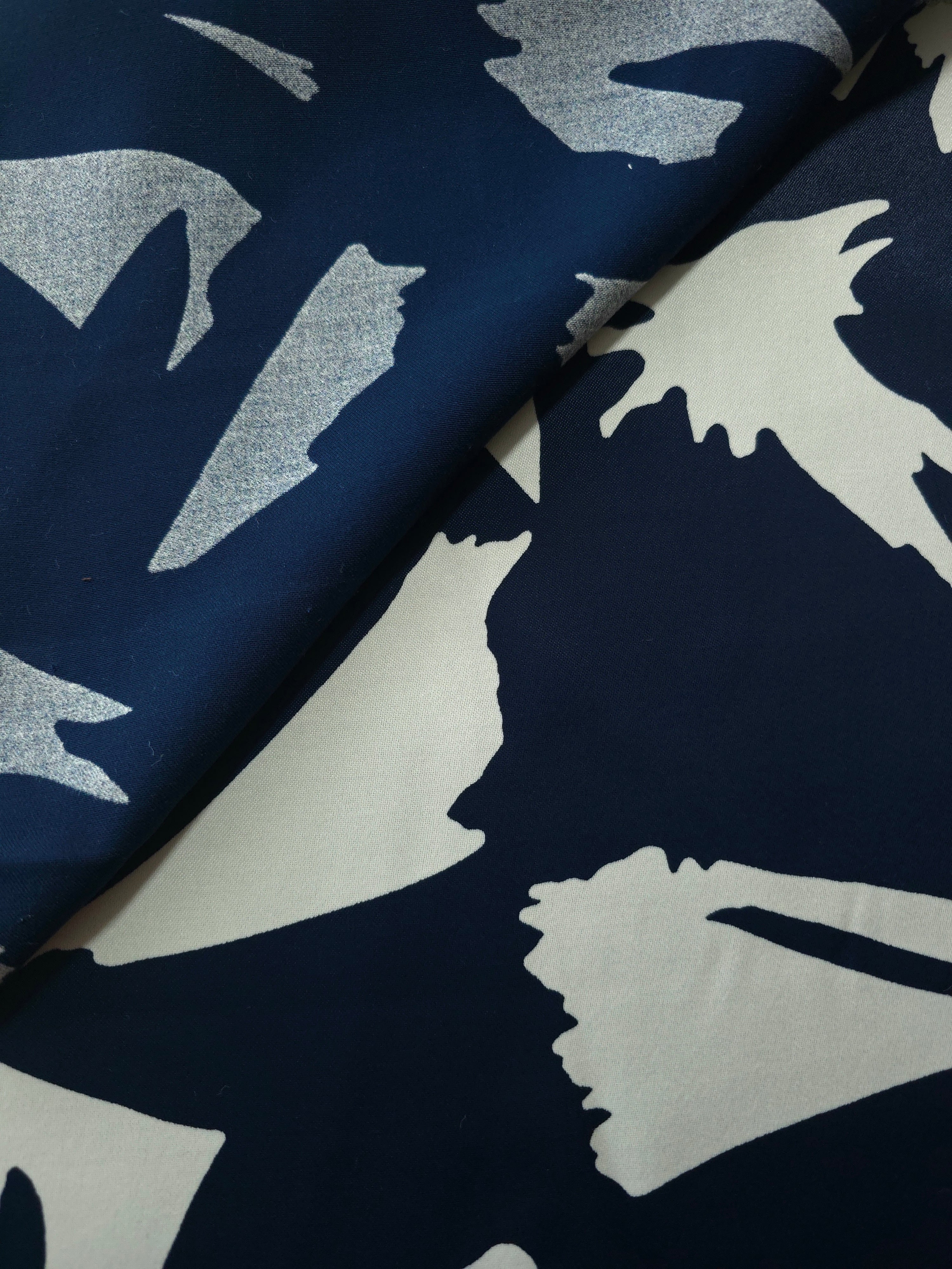 Front and back view of Midnight Blue - Black bold abstract petal rayon fabric for modest dress lining decisions.