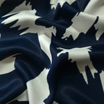 Wave shot of Midnight Blue - Black silky rayon with bold petal print for flowing Eid abayas and kaftans.