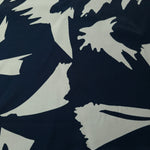 Wide shot of Midnight Blue - Black Turkish rayon fabric with bold abstract petal print for abaya and kaftan yardage.
