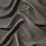 Draped Warm Charcoal Gray Korean polyester crepe showing opaque fluid folds for evening dresses and occasionwear