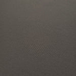 Close-up of Warm Charcoal Gray 100% mechanical polyester crepe showing fine woven texture and a silky-soft hand feel