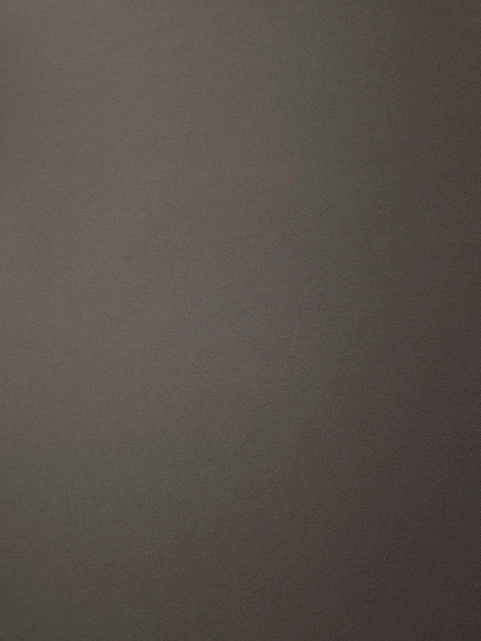 Warm Charcoal Gray 205 GSM Korean polyester crepe shown flat, an opaque woven dress fabric with a silky-soft finish