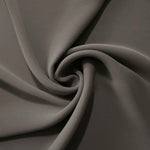 Warm Charcoal Gray polyester crepe arranged in a flowing swirl, showing drape used for abayas and modest fashion