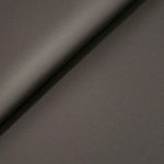 Warm Charcoal Gray Korean polyester crepe in a soft fold, showing fluid drape for blouses and flowing dresses