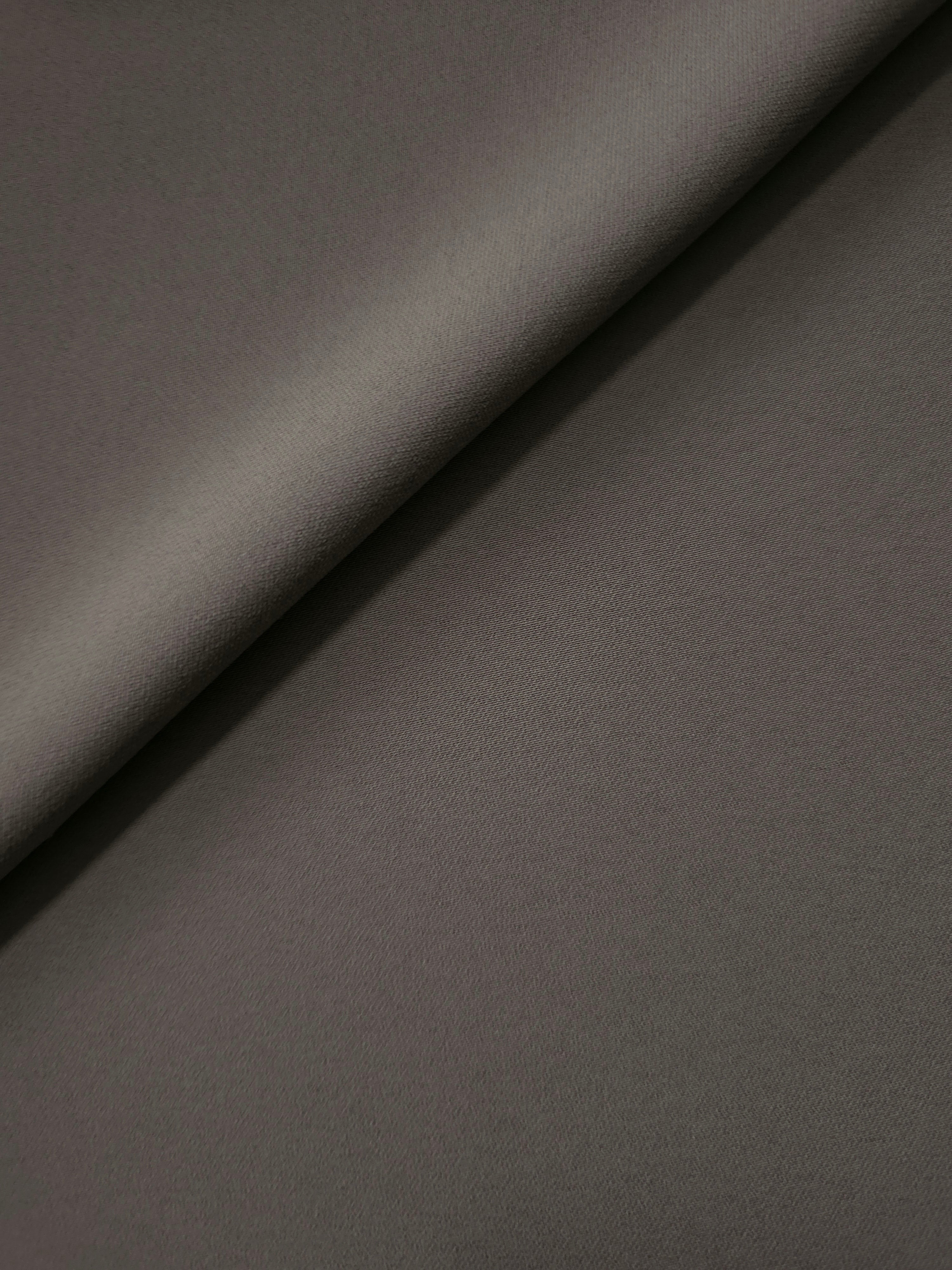 Warm Charcoal Gray Korean polyester crepe in a soft fold, showing fluid drape for blouses and flowing dresses