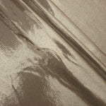Layered Warm Greige Beige shimmer stretch fabric showing metallic foil depth and soft structure for costumes, skirts and fashion apparel