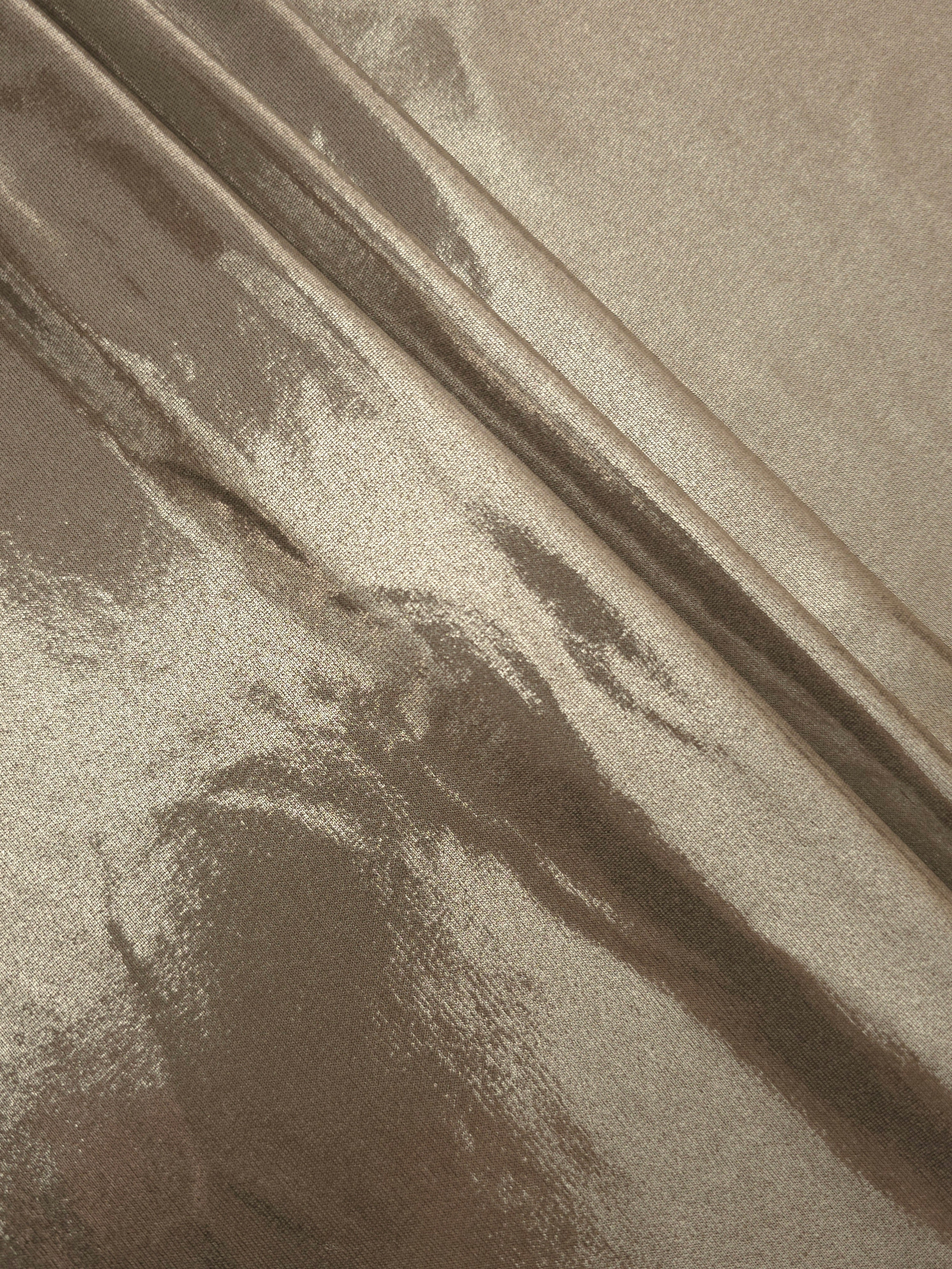 Layered Warm Greige Beige shimmer stretch fabric showing metallic foil depth and soft structure for costumes, skirts and fashion apparel