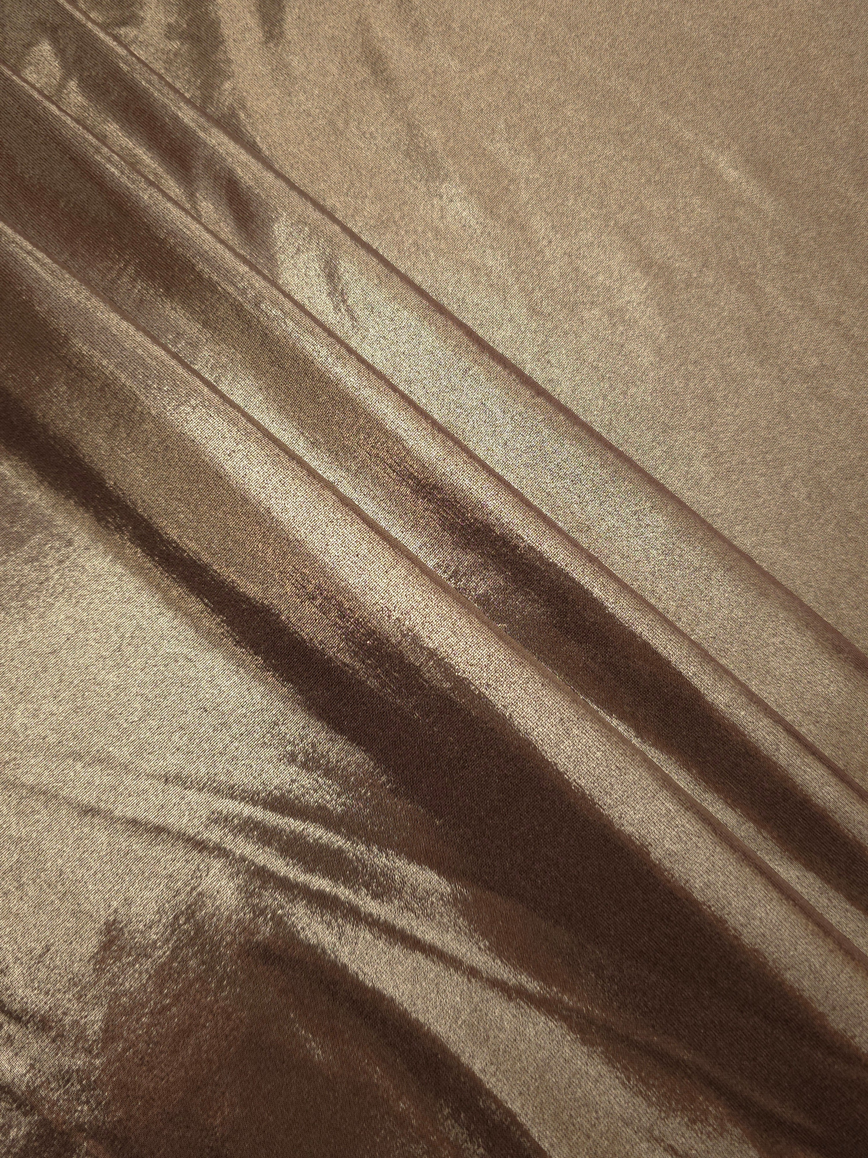 Layered Warm Mushroom Taupe metallic stretch fabric with reflective foil finish, showing flexible body for dancewear and occasion fashion