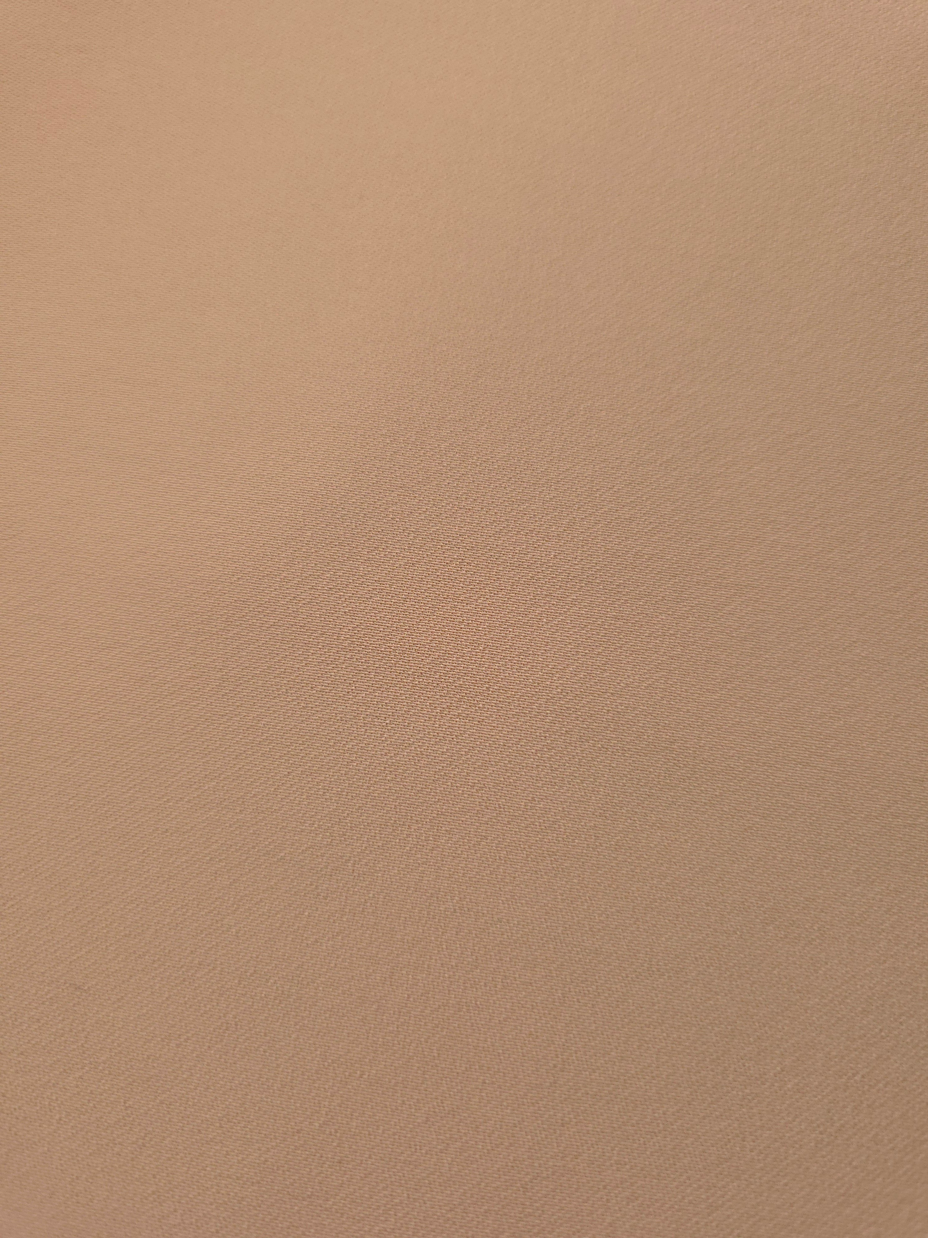 Fine texture close-up of Warm Sand Beige mechanical polyester crepe showing a smooth, silky-soft woven hand