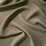 Fluid folds of Warm Stone Taupe opaque Korean crepe, a dress fabric suited to eveningwear and flowing skirts