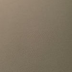 Texture detail of Warm Stone Taupe mechanical polyester crepe, a smooth woven fabric with a soft silky hand