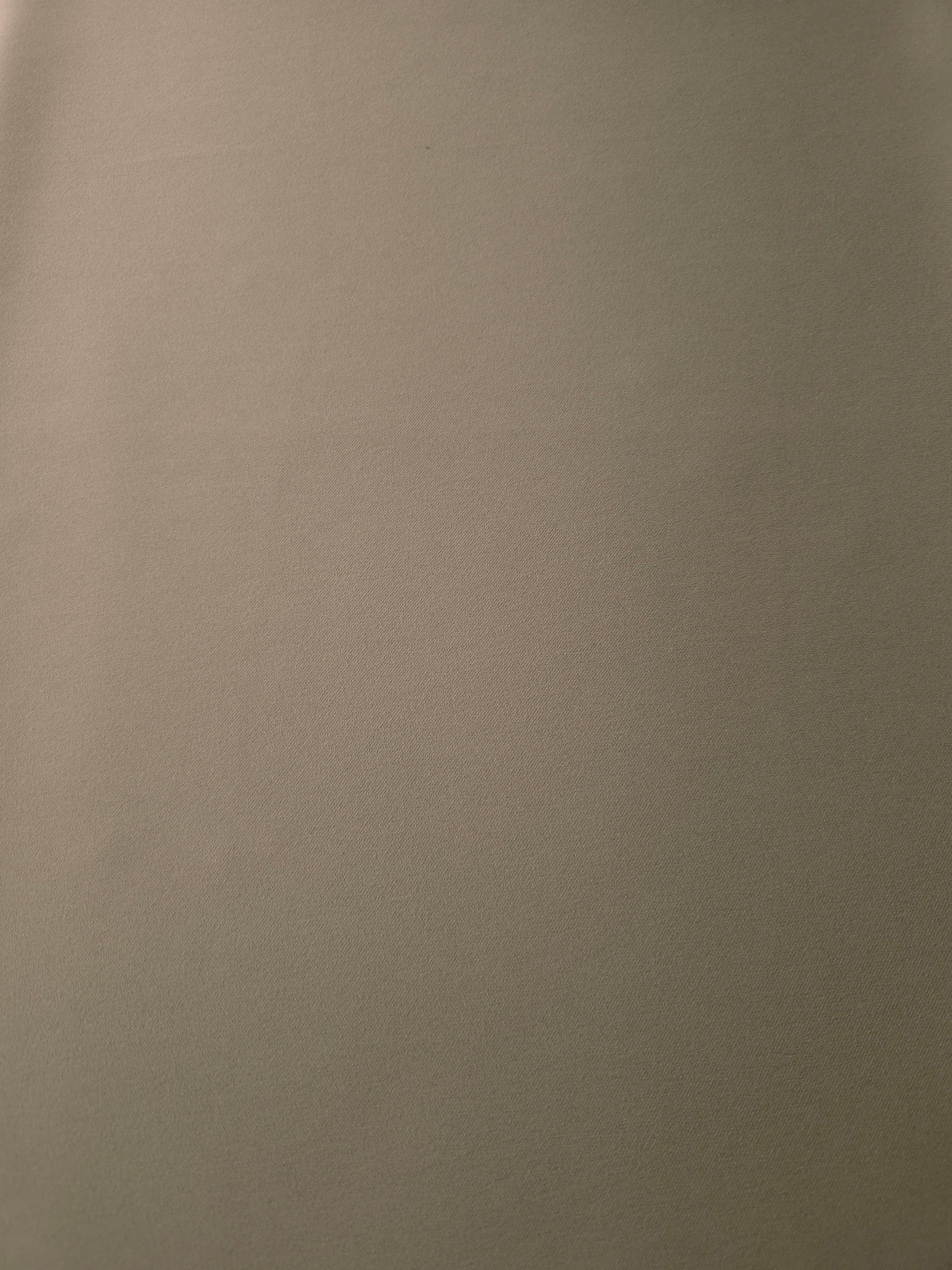 Warm Stone Taupe Korean crepe fabric shown flat, 205 GSM opaque polyester with a smooth surface and silky-soft hand