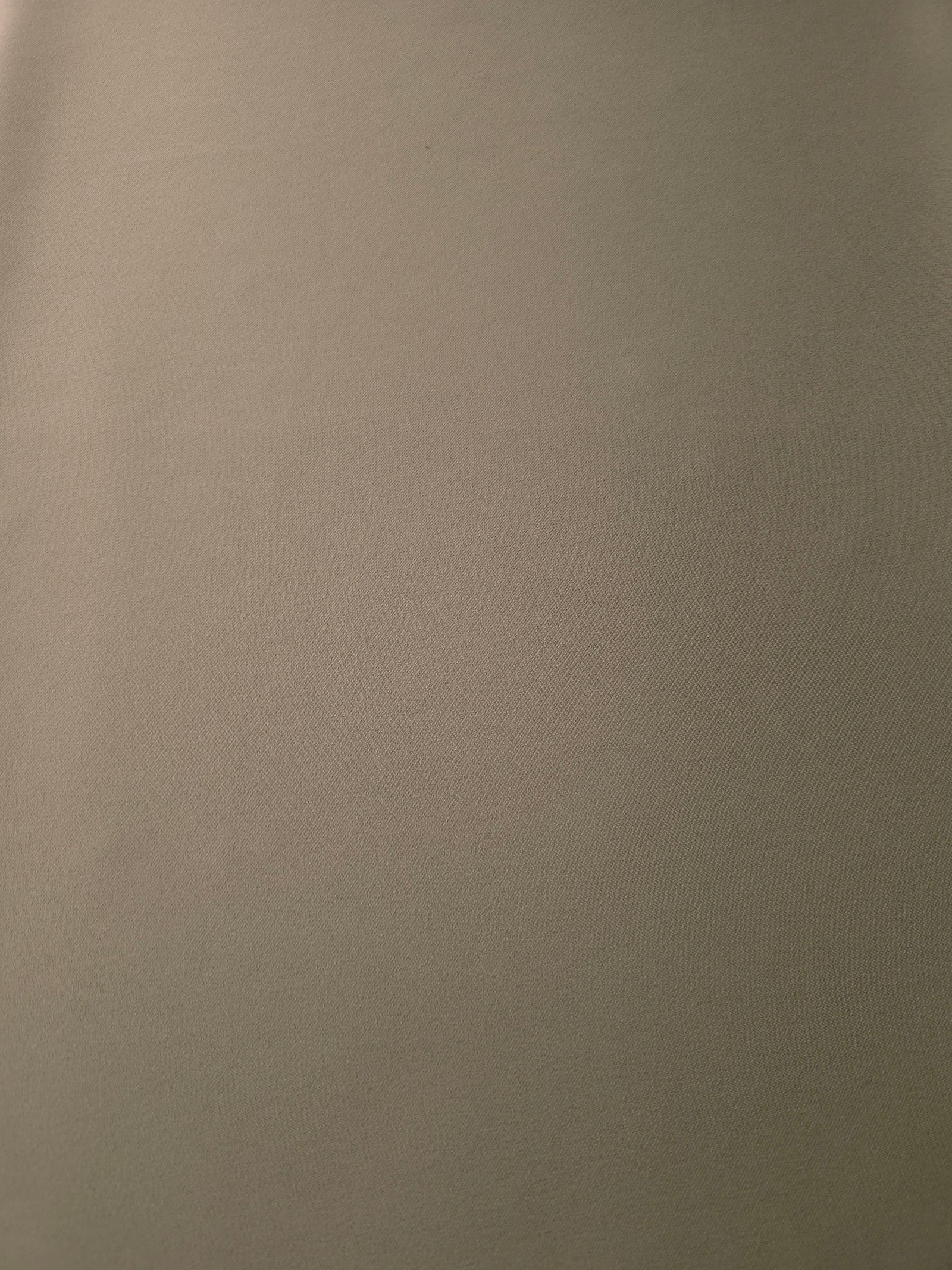 Warm Stone Taupe Korean crepe fabric shown flat, 205 GSM opaque polyester with a smooth surface and silky-soft hand