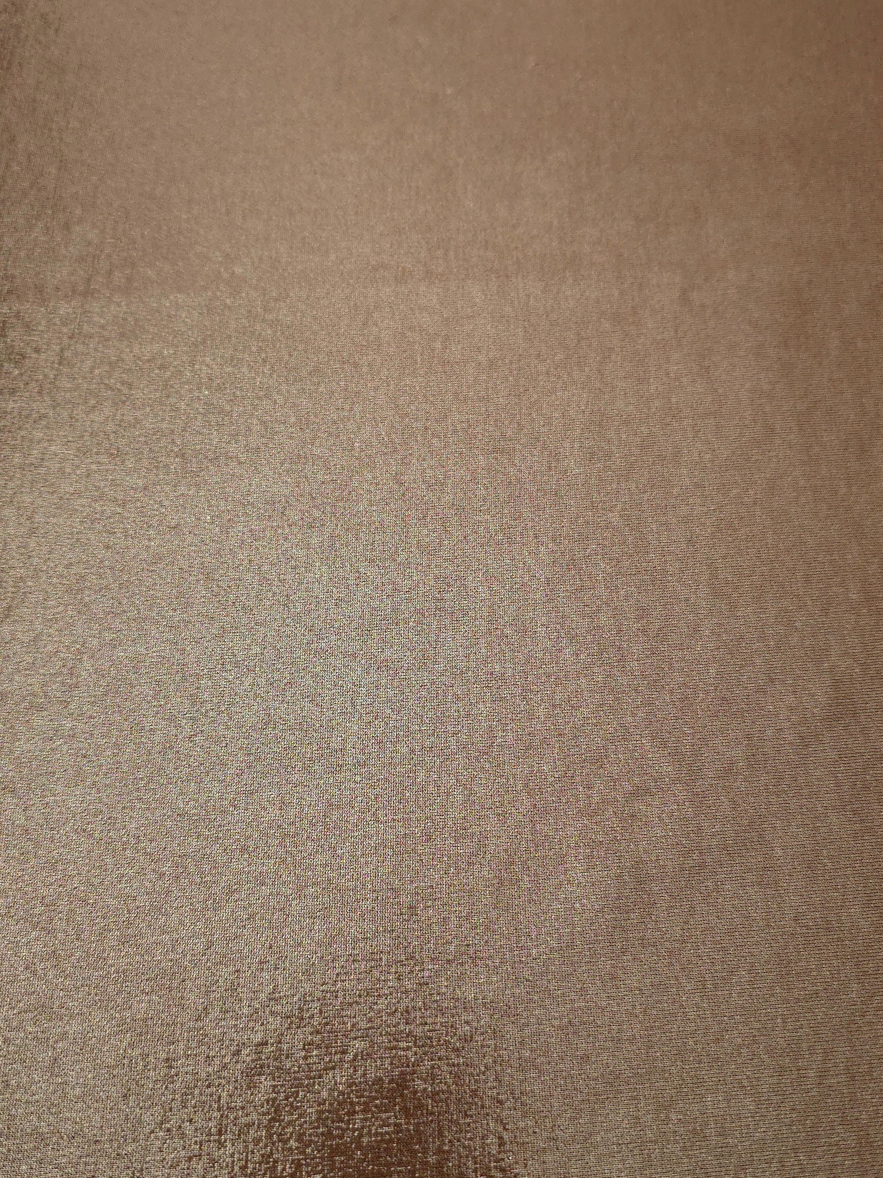 Flat view of Warm Taupe Beige shimmer stretch fabric showing its metallic foil surface for costumes, partywear and fashion apparel