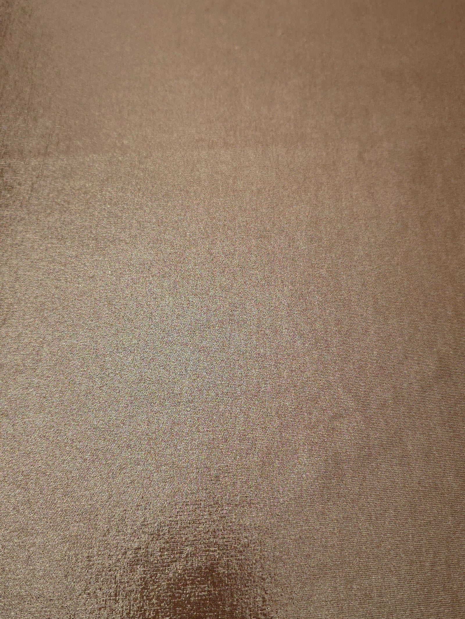 Flat view of Warm Taupe Beige shimmer stretch fabric showing its metallic foil surface for costumes, partywear and fashion apparel