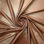 Swirled Warm Taupe Beige metallic foiled spandex showing fluid movement and luminous sheen for dresses, dancewear and stage costumes