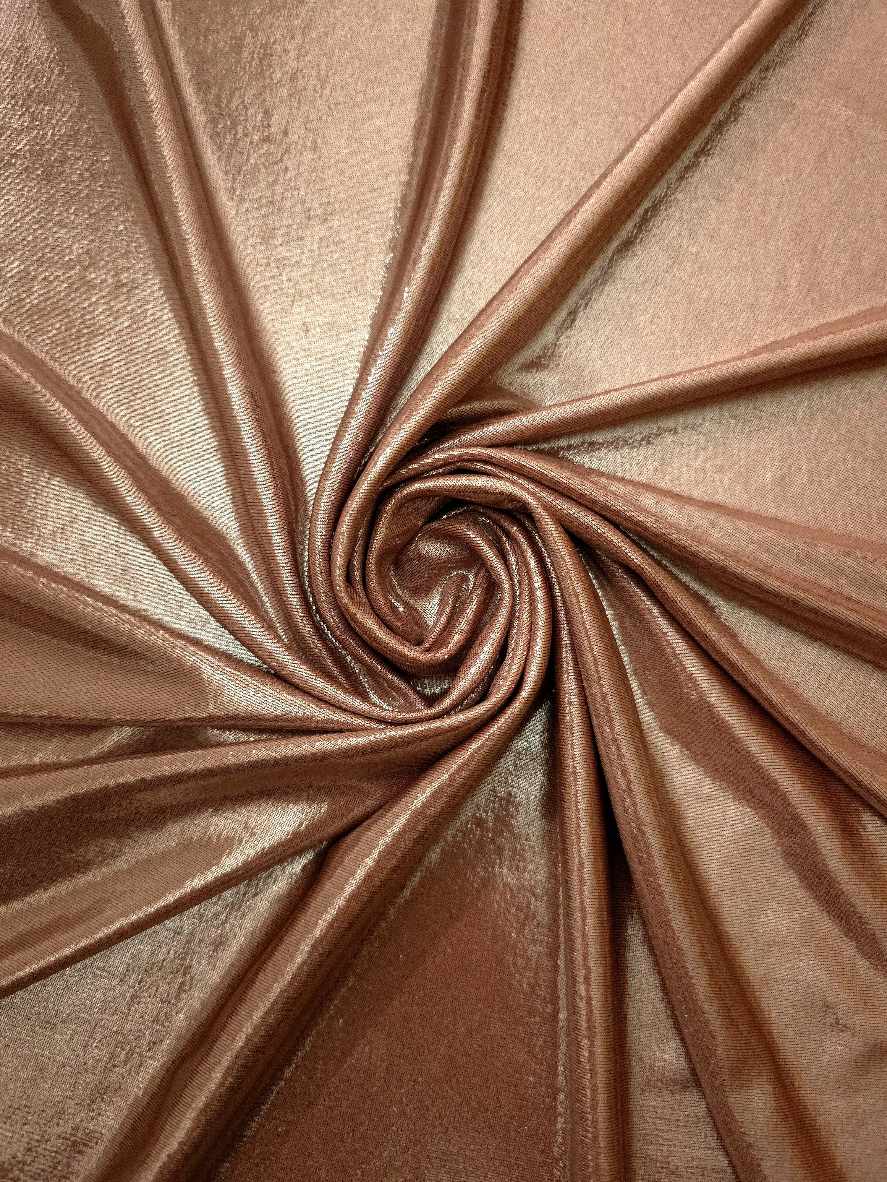 Swirled Warm Taupe Beige metallic foiled spandex showing fluid movement and luminous sheen for dresses, dancewear and stage costumes