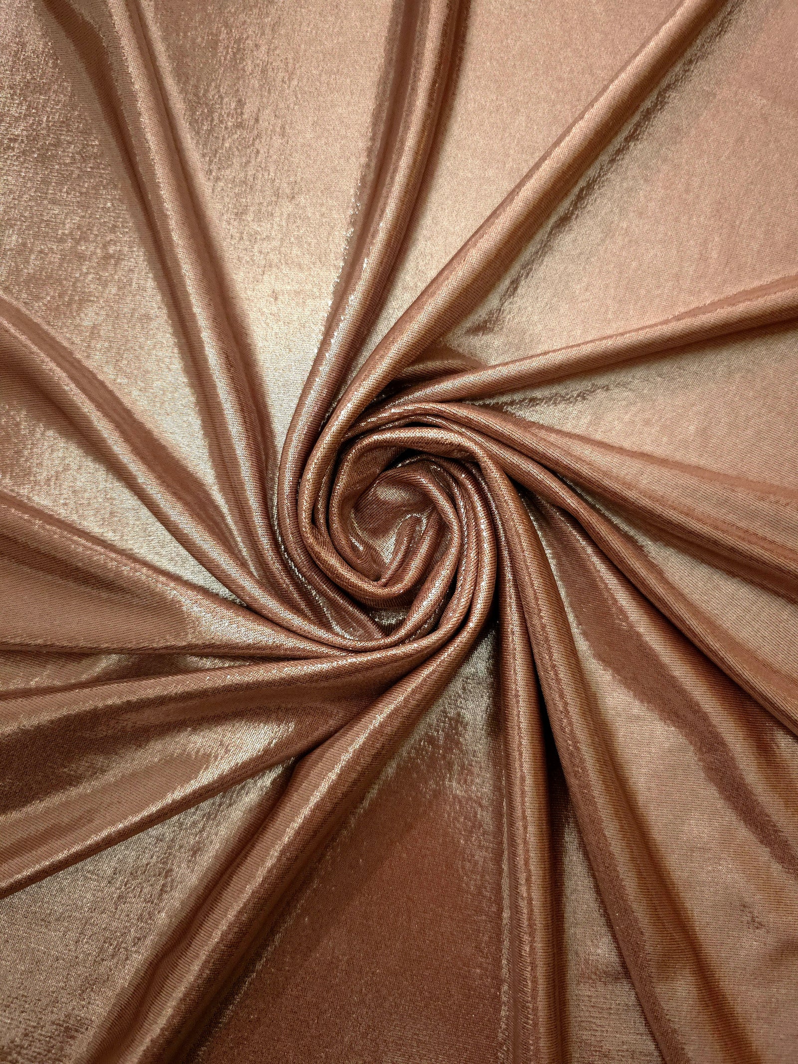 Swirled Warm Taupe Beige metallic foiled spandex showing fluid movement and luminous sheen for dresses, dancewear and stage costumes
