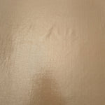 Warm Taupe Beige metallic foiled spandex shown flat, reflective stretch fabric for dancewear, eveningwear and statement garments